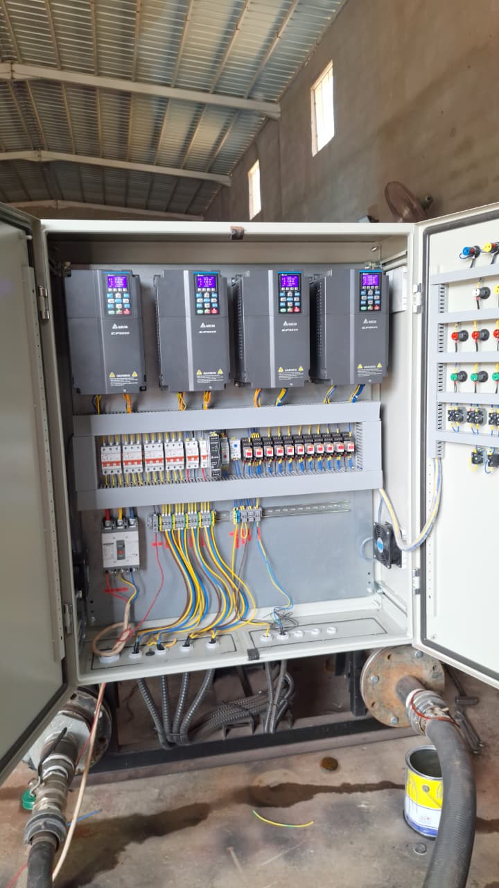 Control panel with four Delta CP2000 drives wired for multi-pump master-slave operation